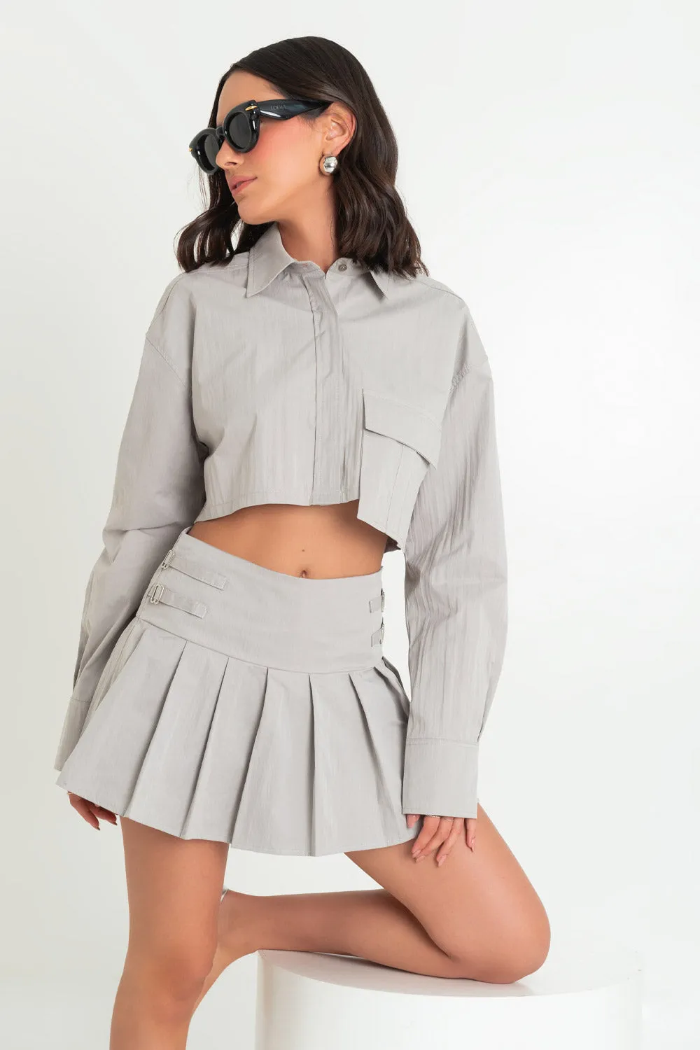 Camisa cropped de manga larga bolsillo